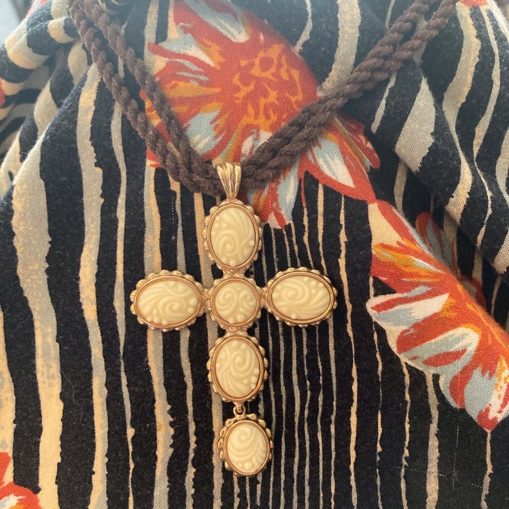 Guess cross necklace on brown cord with clasp